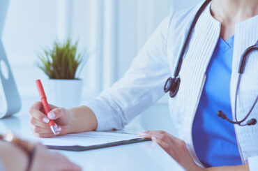 Doctor performing a Medical Evaluation & Physical Examination